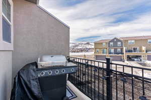 Balcony with a mountain view and grilling area