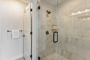 Bathroom with a shower with shower door