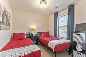 Bedroom featuring carpet flooring