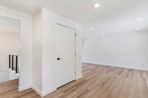 Hallway featuring light wood-type flooring