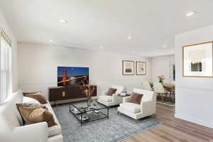 Living room with wood-type flooring. Virtual Staging