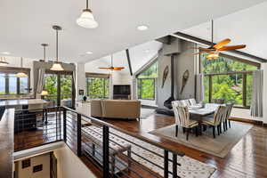 Dining area with ceiling fan and a wealth of natural light