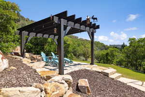 View of yard featuring a pergola and a patio area