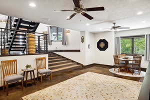 Interior space featuring a textured ceiling and ceiling fan