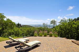 View of patio / terrace with a mountain view