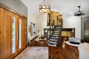 Entryway featuring lofted ceiling, french doors, and hardwood / wood-style flooring