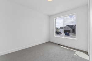 Empty room featuring carpet floors