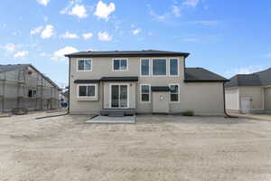 Back of house with a patio