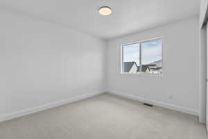 Unfurnished room featuring carpet floors