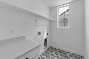 Laundry room featuring tile patterned flooring, electric dryer hookup, and washer hookup