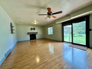 Walk out family room with GAS LOG FIREPLACE  and newly replaced sliding door