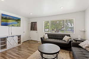 Living room with light hardwood / wood-style floors