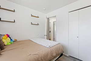 Bedroom featuring a closet and carpet flooring