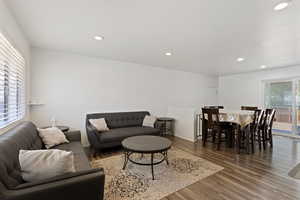 Living room featuring hardwood / wood-style flooring and plenty of natural light