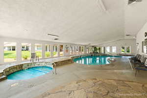 View of swimming pool and hot tub