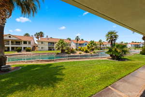 View of pool featuring a yard