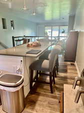 Dining space with dark wood-type flooring