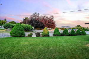 Yard at dusk with a mountain view