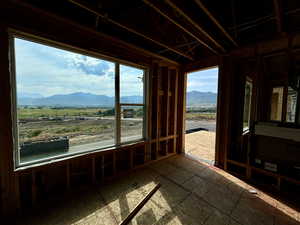 Sunroom featuring a mountain view