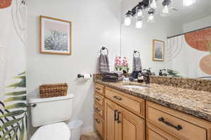 Bathroom with vanity and toilet