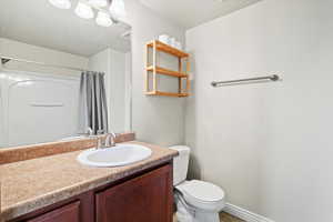 Bathroom with vanity and toilet