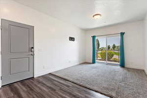 Spare room featuring dark hardwood / wood-style floors