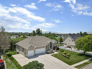 Ranch-style home with a front lawn