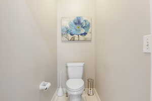 Bathroom featuring tile patterned floors and toilet