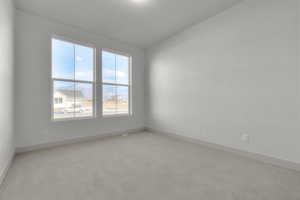 Spare room featuring light colored carpet