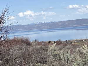 View of water feature with a mountain view