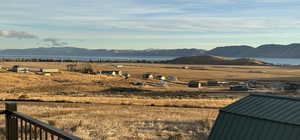 View of mountain feature featuring a rural view and a water view