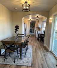 Dining room with hardwood / wood-style flooring, a textured ceiling, and sink