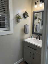 Bathroom featuring hardwood / wood-style floors and vanity