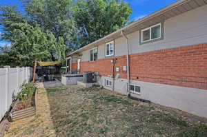 Exterior space featuring a patio and central AC unit