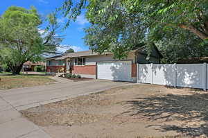 View of front facade featuring a garage