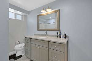 Bathroom featuring toilet and vanity