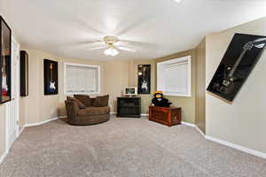 Bedroom featuring carpet and ceiling fan