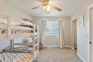 Bedroom with carpet floors and ceiling fan