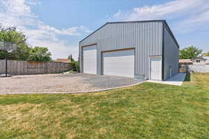 Garage featuring a yard