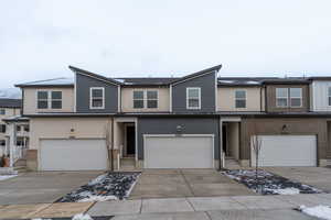 View of front of property featuring a garage