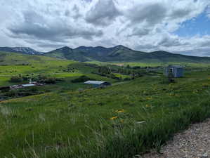 View of mountain backdrop featuring rural landscape