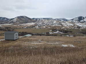 Property view of mountains and new well pump house