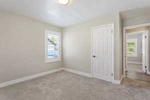 Unfurnished bedroom featuring carpet