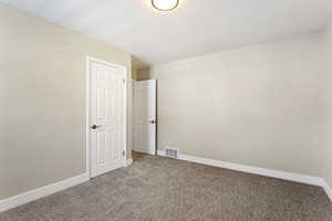 Unfurnished bedroom with carpet floors