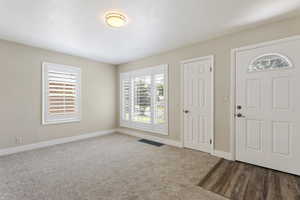 View of carpeted foyer