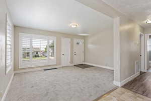 Entryway featuring carpet flooring