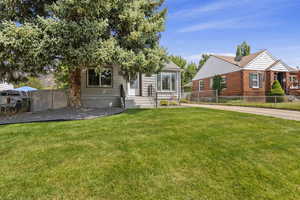 View of front of property with a front lawn