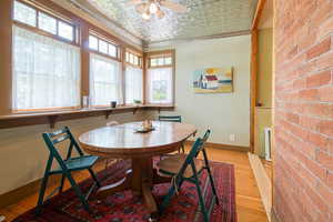 Main floor dining area with exposed brick