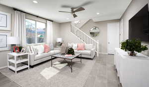 Living room featuring  open concept, natural light with LVT flooring. Railing is not included in this house.Photo of the model; actual materials and colors selected may vary.