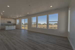 Kitchen & Great Room *Photo of similar plan in community, colors and options will vary*